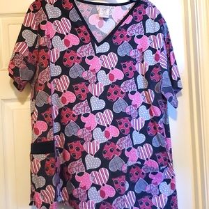 Primarily black with gray and pink scrub top. 2X